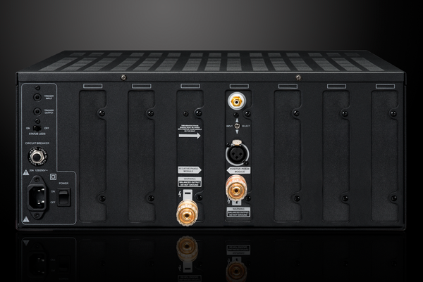 Back panel of XPA-DR1 amplifier, showing amplifier modules, empty upgrade slots and various inputs/outputs