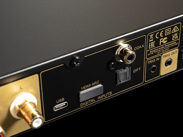 Back panel of an electronic device with various connectivity ports on a black background