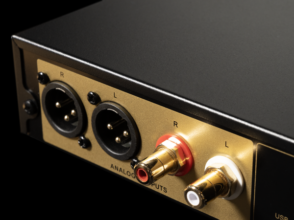 Audio interface with analog inputs on a black background