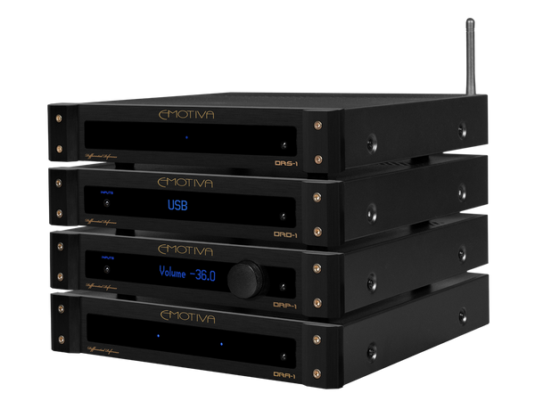 Stack of black audio equipment with 'Emotiva' branding on a white background