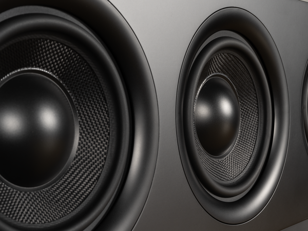 closeup photo of the speaker woofers on the Airmotiv XC3 center channel loudspeaker