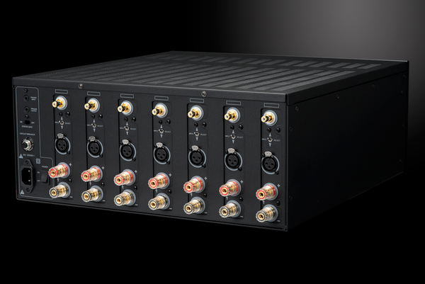 Photo of the rear isometric view of the XPA Gen3 7 Channel Amplifier on a dramatic gray background showing off the inputs and outputs